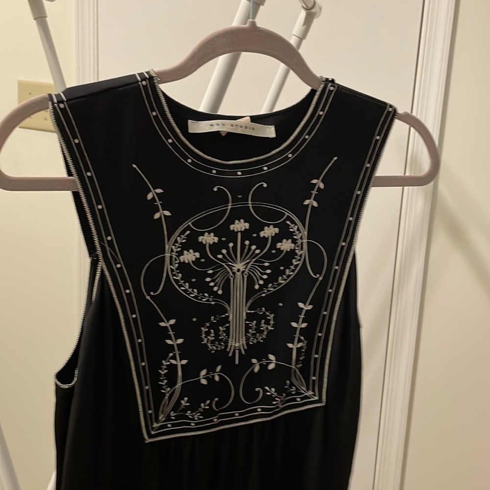 Gorgeous black dress cream stitching around borders.